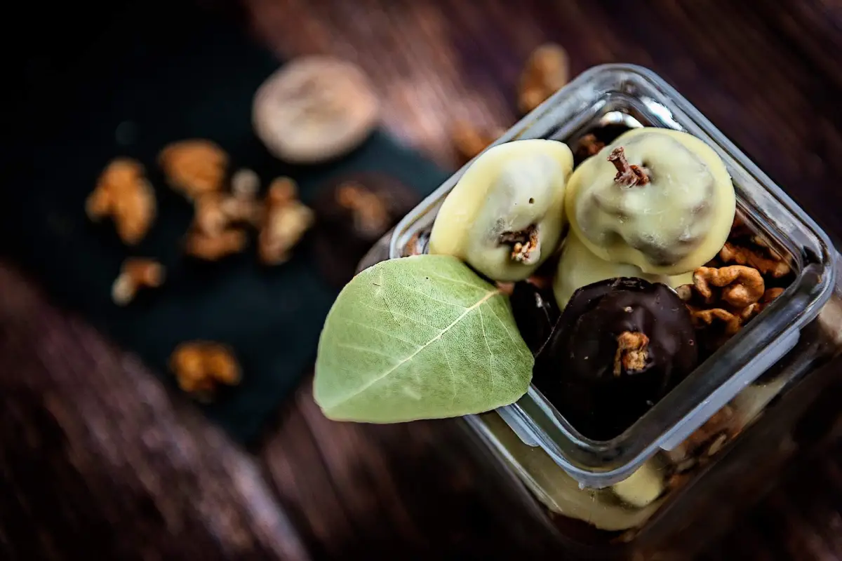 Open jar of artisan chocolate topped with dried figs, walnuts and almonds – Dalmatian delicacy from Terra Croatica Souvenir Shop in Dubrovnik.